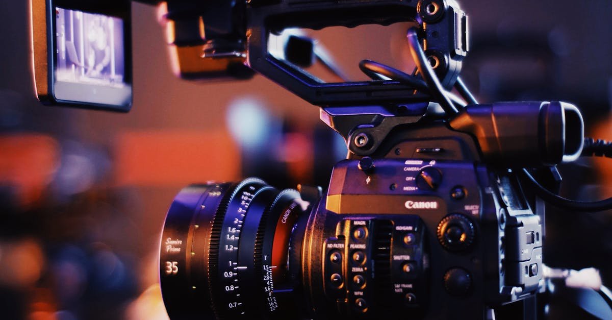 Close-up of a professional video camera setup indoors, capturing high-quality footage.